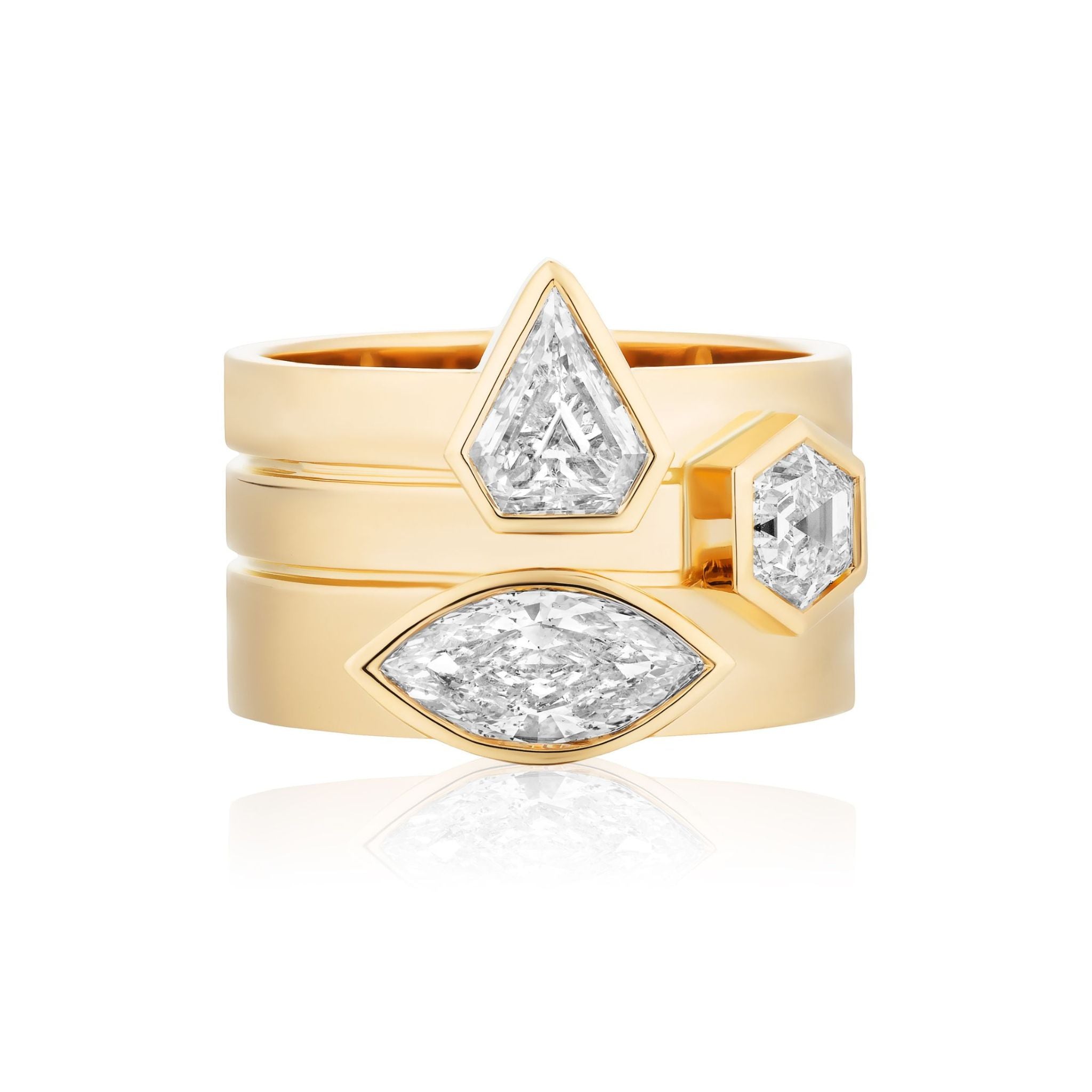 Three stacked Bezel Set Mixed Shape Diamond Thick Bands in Yellow Gold, each accented with bezel-set diamonds in pear, hexagonal, and marquise shapes, displayed against a white background.