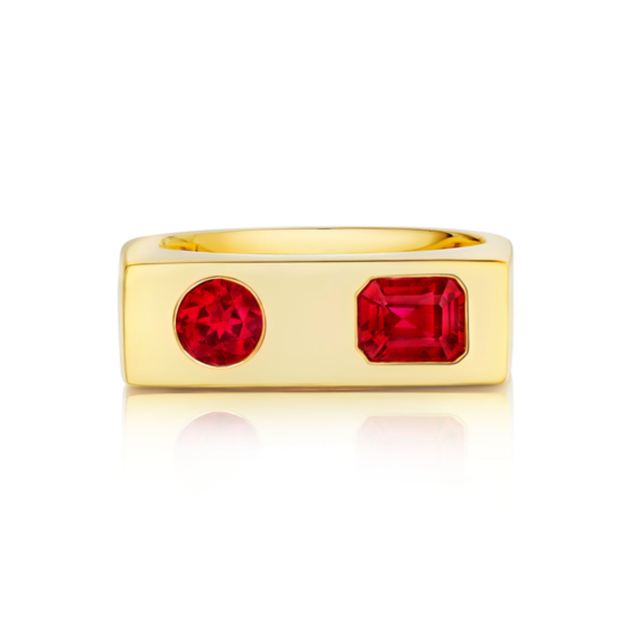 The Mixed Shape Ruby Bar Ring in Yellow Gold features a rectangular yellow gold band adorned with one round and one emerald-cut red ruby set side by side. This distinctive design offers a stunning example of customizable jewelry, making it an ideal choice for those seeking a modern yet timeless accessory.