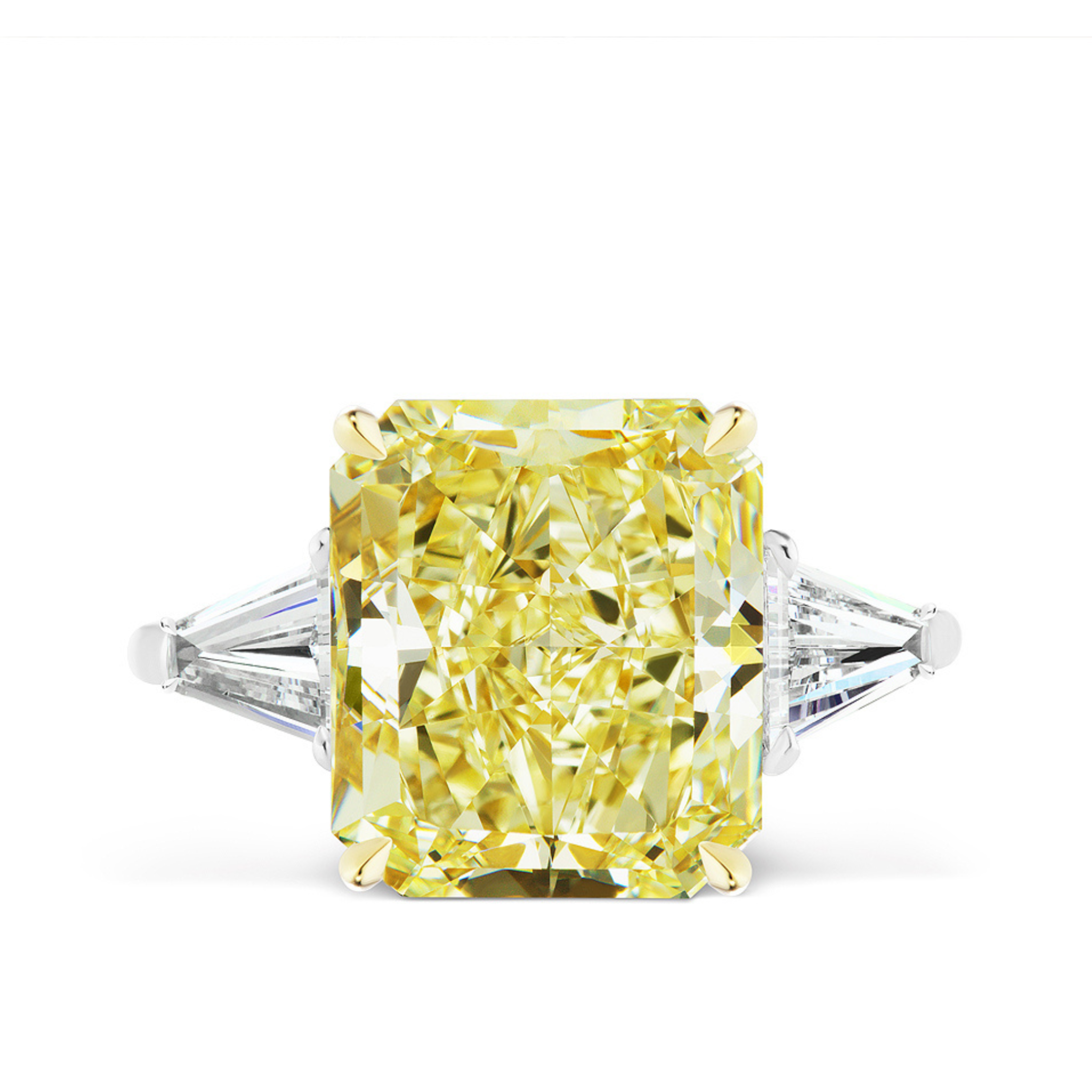 The Fancy Yellow Radiant Cut Diamond Engagement Ring features a large yellow radiant cut diamond center with tapered baguette side stones, set in a white and yellow metal band.