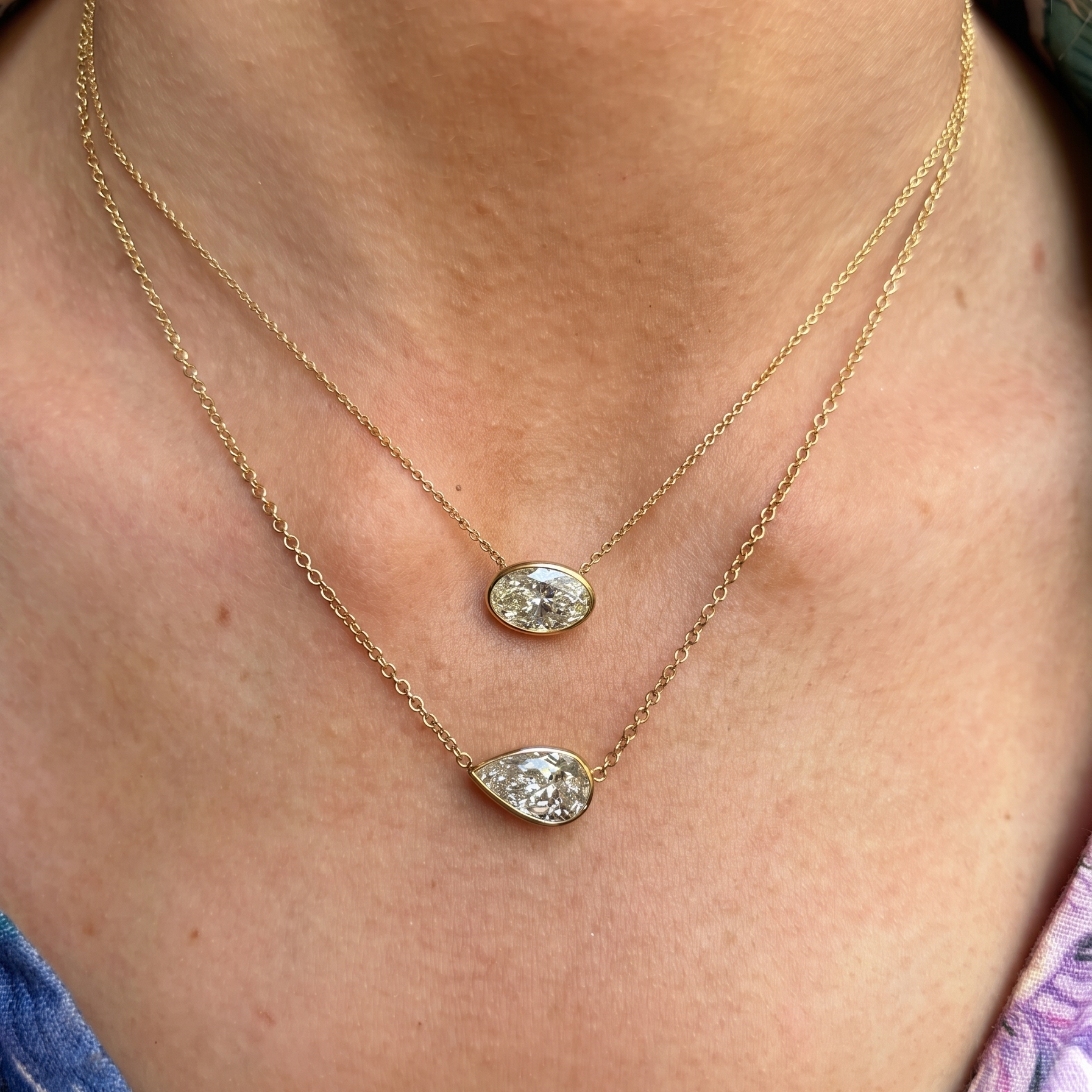 East-West Bezel Set Oval Shape Diamond Pendant Necklace in Yellow Gold