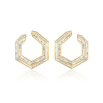 Chrysler Front-To-Back Hoops with Baguette Diamonds feature geometric hexagonal 18K gold hoops, each set with baguette diamonds outlining their modern, angular design.