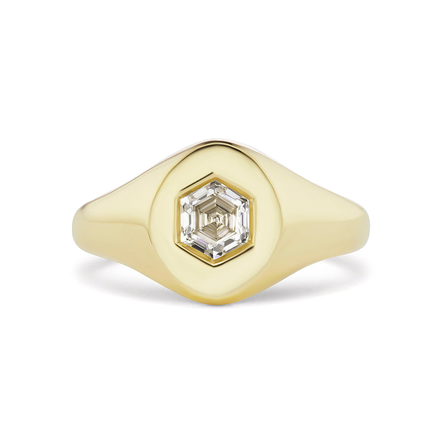 The Signet Ring with Hexagon Diamond features a polished gold band and a central bezel-set hexagon diamond for a modern, elegant look.