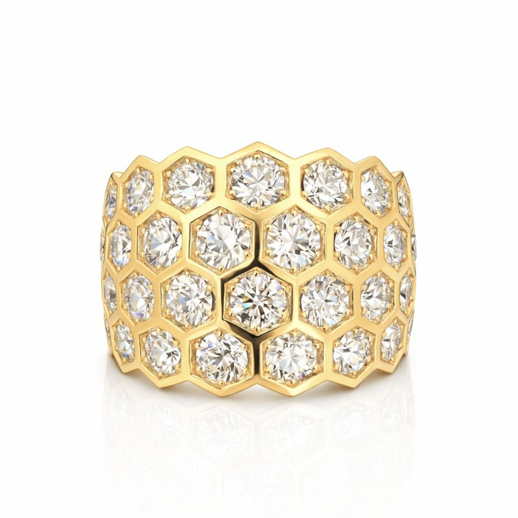 The Hexagon Bezel Set Multi-Tier Chunky Band features round diamonds set in each honeycomb-patterned hexagon, crafted in luxurious 18k yellow gold for an intricate, eye-catching design.