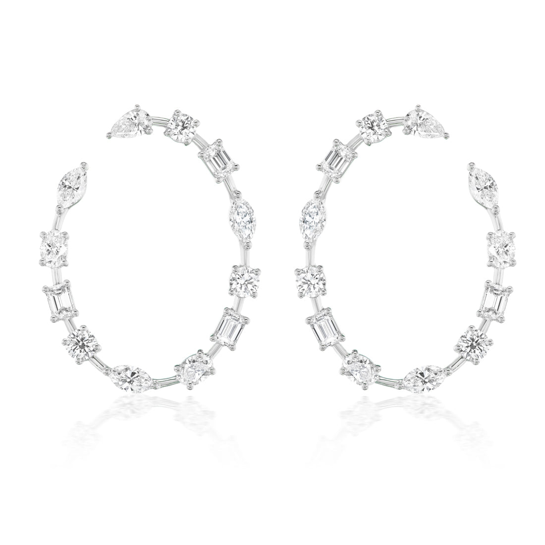 The Light Mixed Shape Diamond Hoops are large white metal earrings featuring G-H color diamonds in round, oval, rectangular, and marquise cuts arranged along the entire hoop.