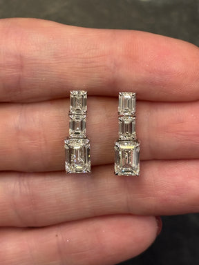 Graduated Emerald Cut Diamond Drop Earrings in White Gold