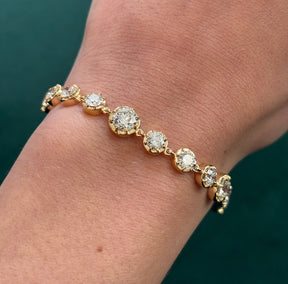 Collet Set Round Diamond Graduated Tennis Bracelet in Yellow Gold