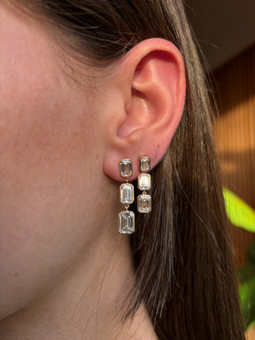 Bezel Set Emerald Cut Diamond Drop Earrings in Yellow Gold
