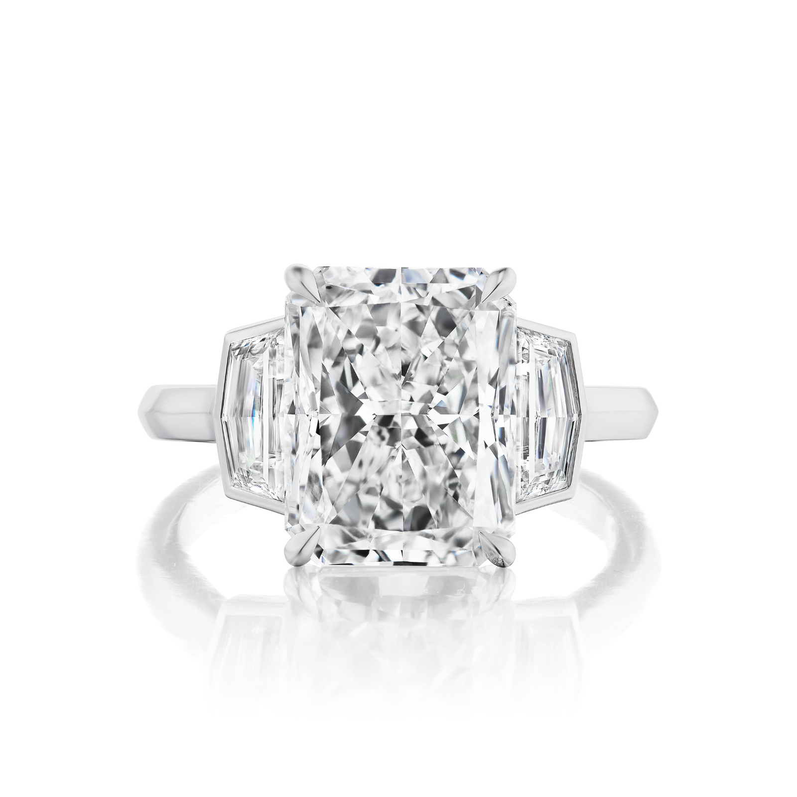 The Radiant Cut Diamond Engagement Ring with Bezel Set Epaulette Side Stones features a stunning rectangular radiant-cut diamond center, flanked by unique epaulette side stones, shown on a white background—a bespoke ring for life’s milestones.