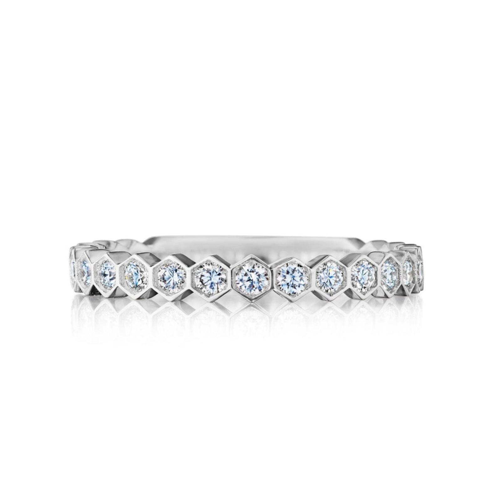 The Hexagon Bezel Set Diamond Band showcases round diamonds in hexagonal bezels encircling the entire band. Crafted in silver, it’s also available in 18K Gold for a luxurious touch.