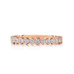The Hexagon Bezel Set Diamond Band in rose gold showcases round diamonds in a continuous hexagonal pattern, shown against a white background.