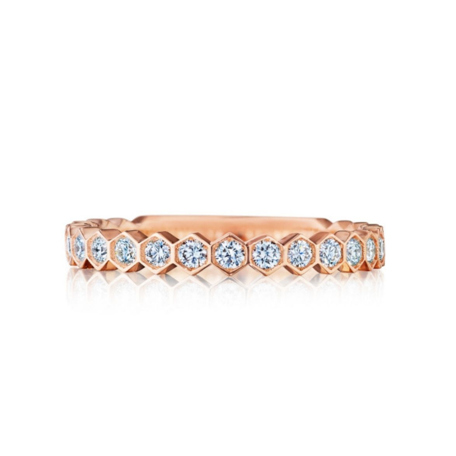 The Hexagon Bezel Set Diamond Band in rose gold showcases round diamonds in a continuous hexagonal pattern, shown against a white background.