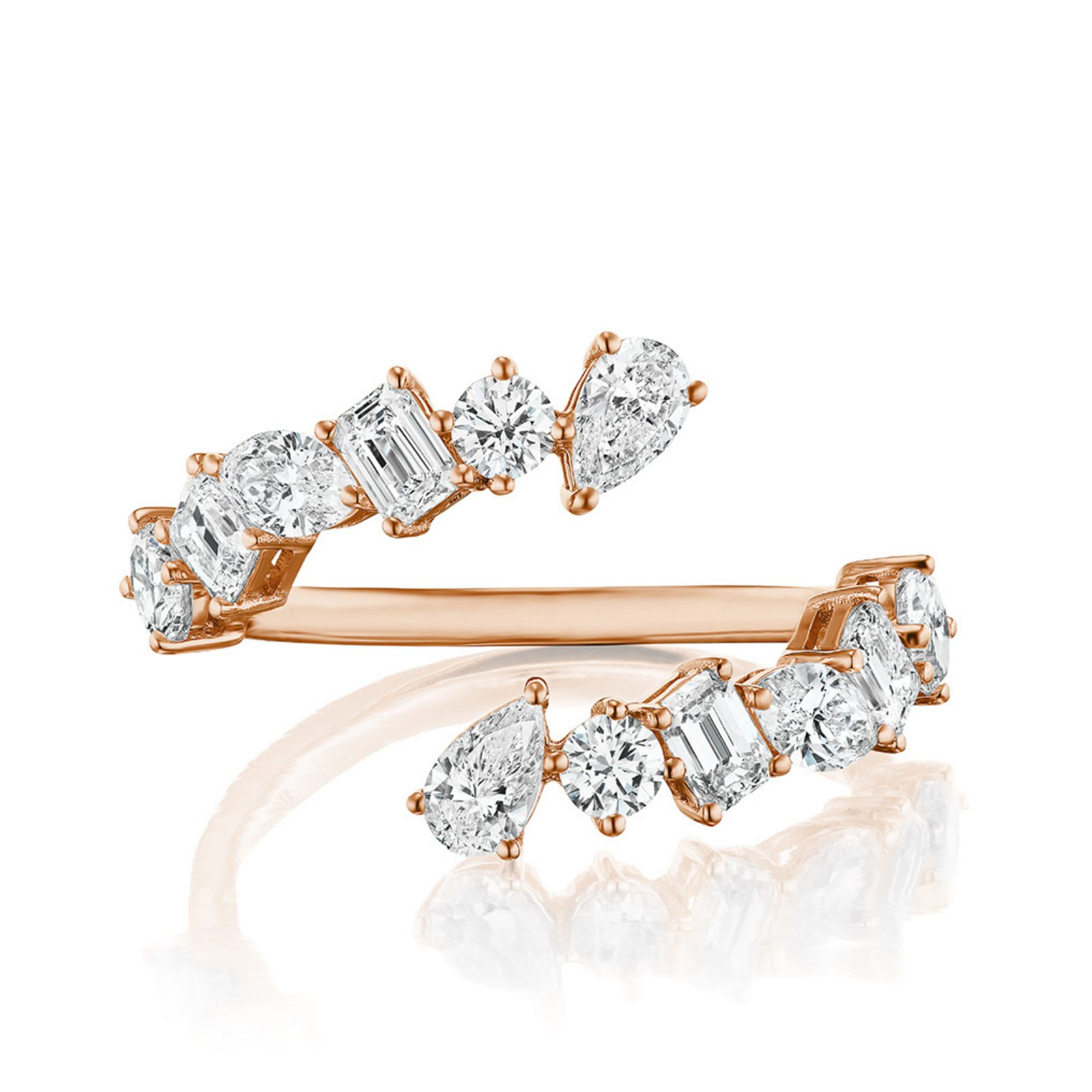 The Wraparound Ring with Mixed Shape Diamonds is crafted in 18K rose gold, featuring an open band adorned with round, emerald, and pear-cut white diamonds arranged asymmetrically for a modern bypass design.