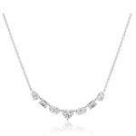 The Mixed Shape Diamond Pendant Necklace features a central heart-shaped diamond, flanked by round and rectangular diamonds in a symmetrical design on an 18K gold chain. Displayed against a plain white background.