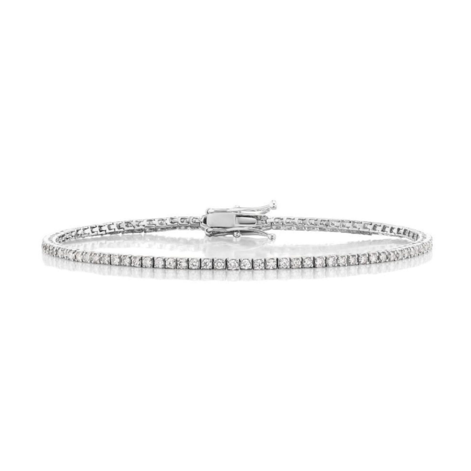 Introducing the Skinny Round Brilliant Diamond Tennis Bracelet—a refined piece showcasing a single row of round brilliant diamonds elegantly set in a slender white gold band with a secure clasp, beautifully displayed against a white background.