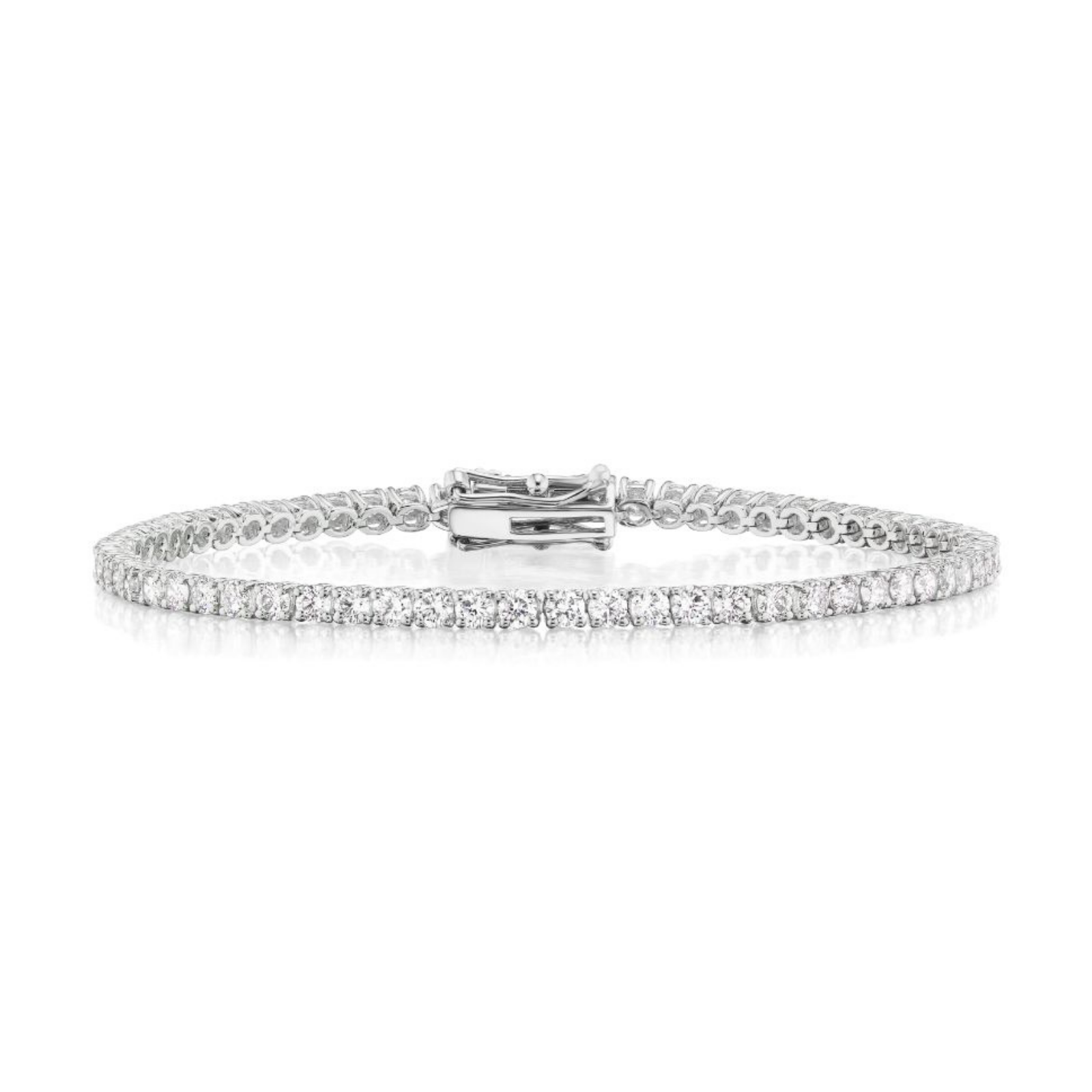 The Round Brilliant Diamond Tennis Bracelet, crafted in 18K white gold and featuring a single row of sparkling round brilliant diamonds, is displayed laid flat on a white background with its secure clasp visible at the center.