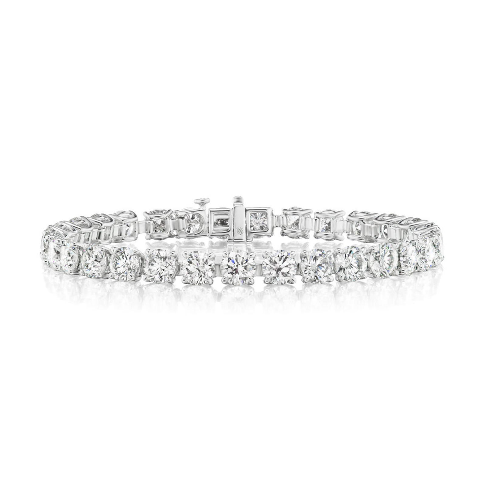 The Round Brilliant Diamond Tennis Bracelet in White Gold showcases dazzling round diamonds, each expertly set in a polished white gold band and elegantly presented against a white background.