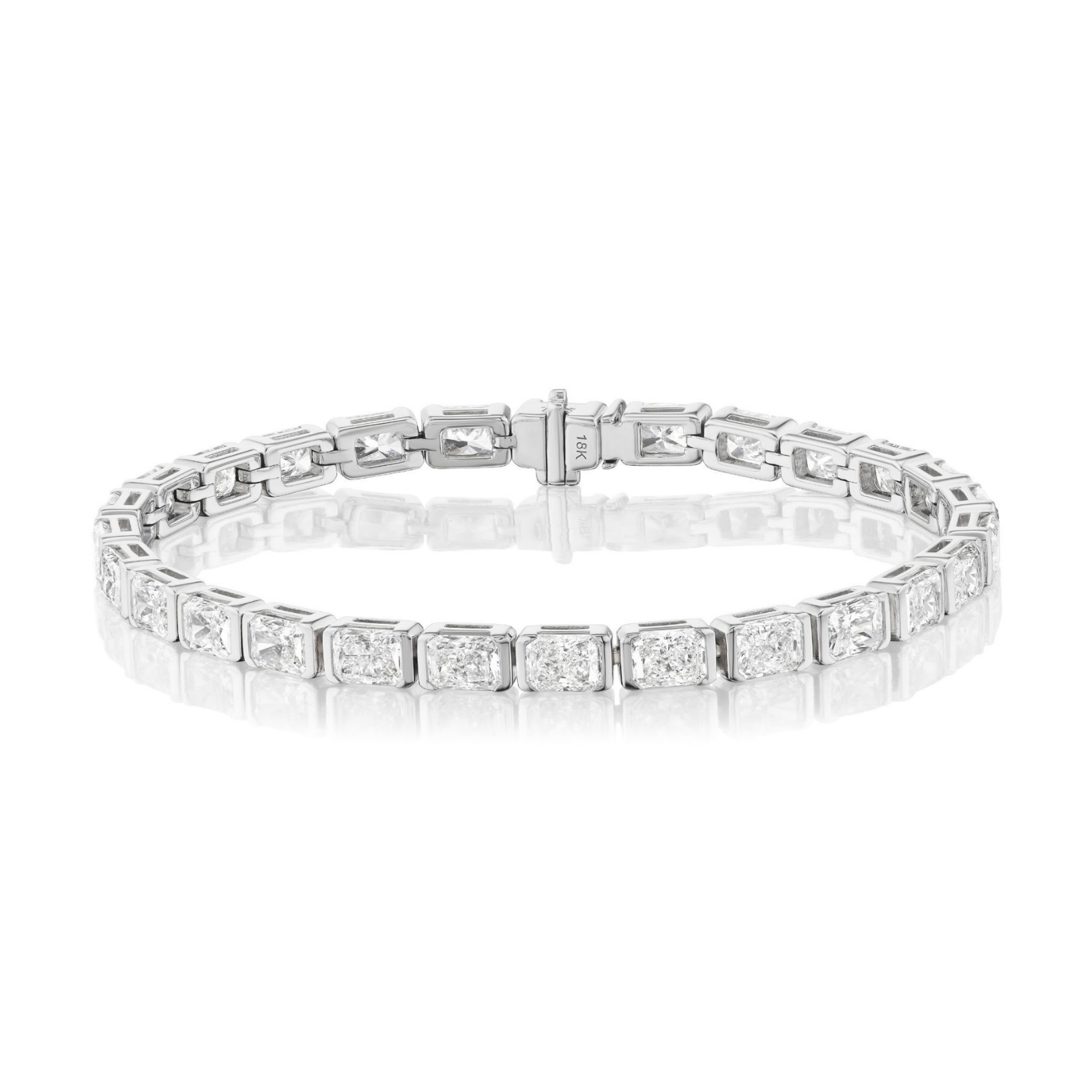 The Half-Bezel Radiant Cut Tennis Bracelet in White Gold showcases a stunning row of radiantly cut diamonds totaling 11.05TCW, set in rectangular links with an elegant 18k white gold clasp, beautifully presented against a white background.