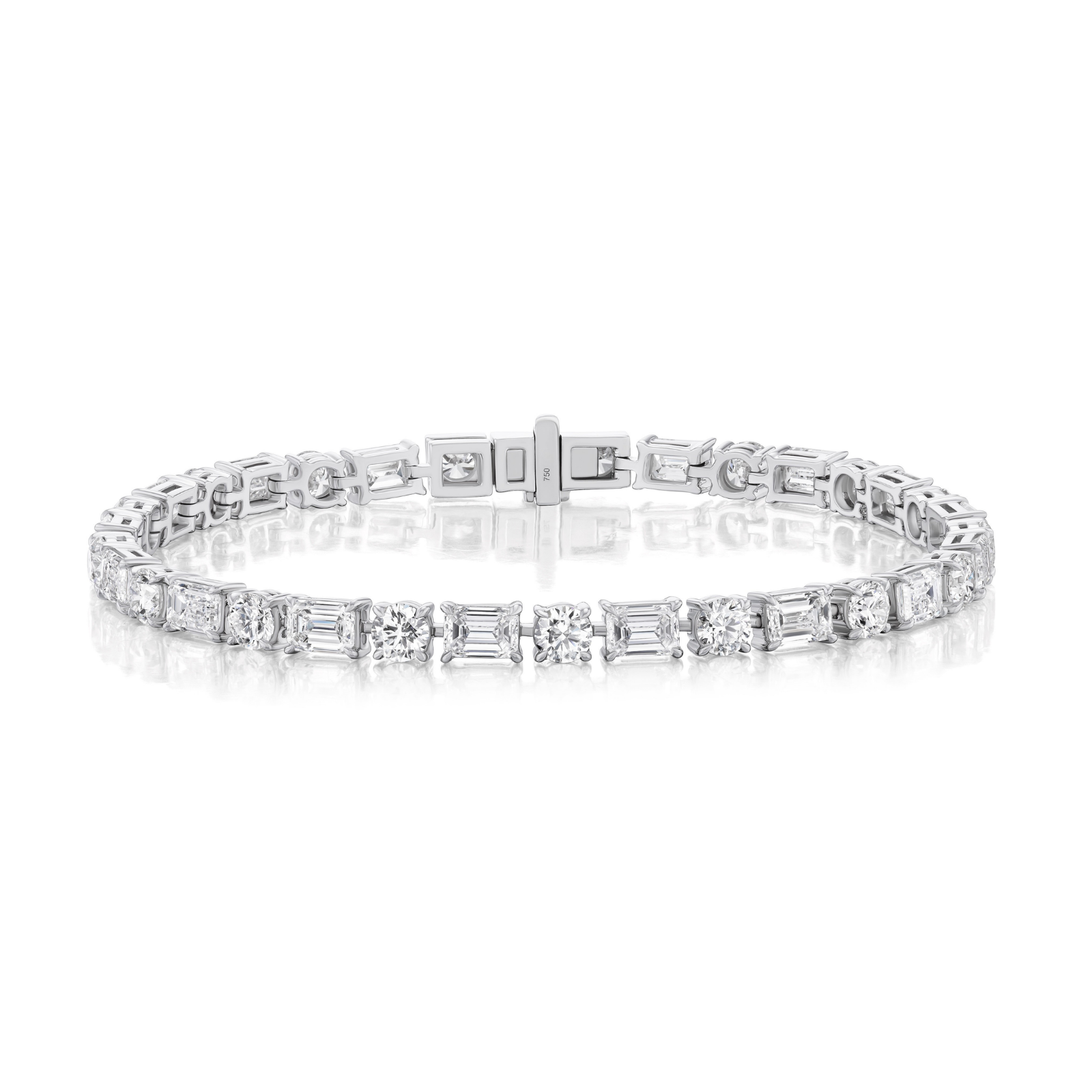 Introducing the Alternating East-West Set Round and Emerald Cut Diamond Tennis Bracelet in White Gold, featuring both round and emerald cut diamonds set in an elegant alternating pattern against a sleek white gold backdrop.