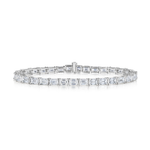 The East-West Emerald Cut Tennis Bracelet showcases emerald-cut diamonds set in a continuous row on an 18K white gold band, displayed against a white background.