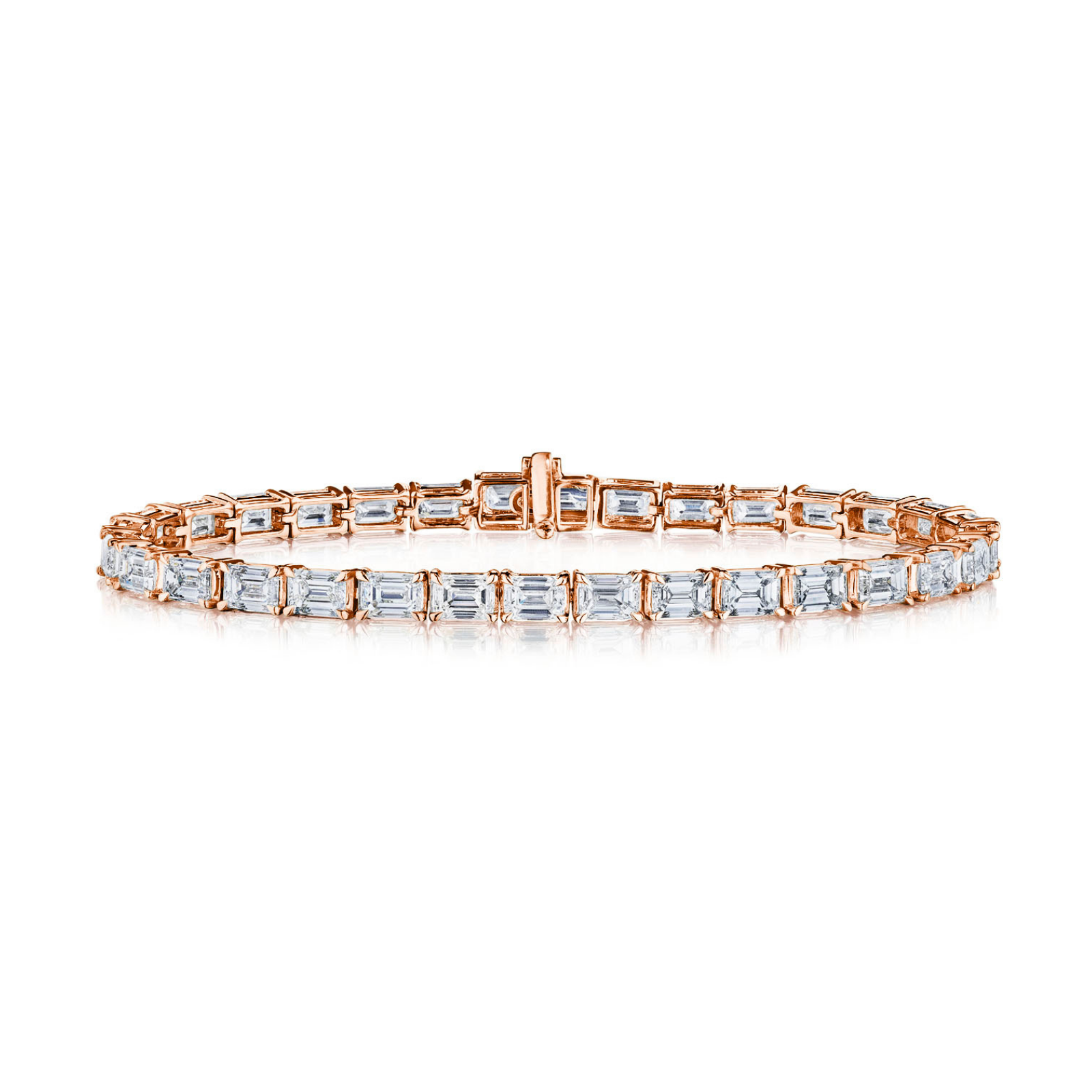 Introducing the East-West Emerald Cut Tennis Bracelet: a rose gold bracelet showcasing a single row of east-west set, emerald-cut clear stones in elegant prong settings, beautifully displayed on a white background.