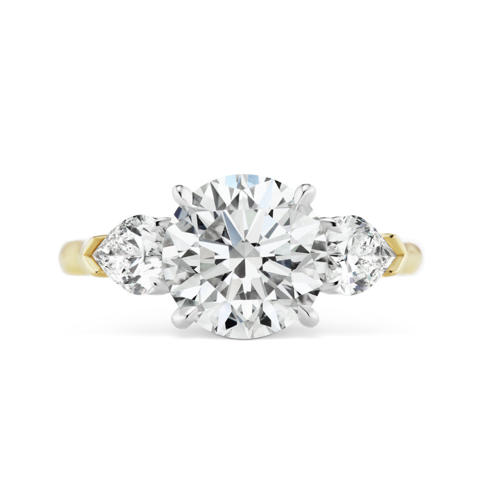The Round Brilliant Diamond Engagement Ring with Heart Side Stones showcases a dazzling round center diamond accented by heart-shaped side stones, all set in prongs against a white background.