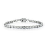 Introducing the East-West Emerald Cut Bezel Bracelet, showcasing a continuous row of bezel-set emerald cut diamonds in 18k white gold with a secure clasp, elegantly displayed on a white background.