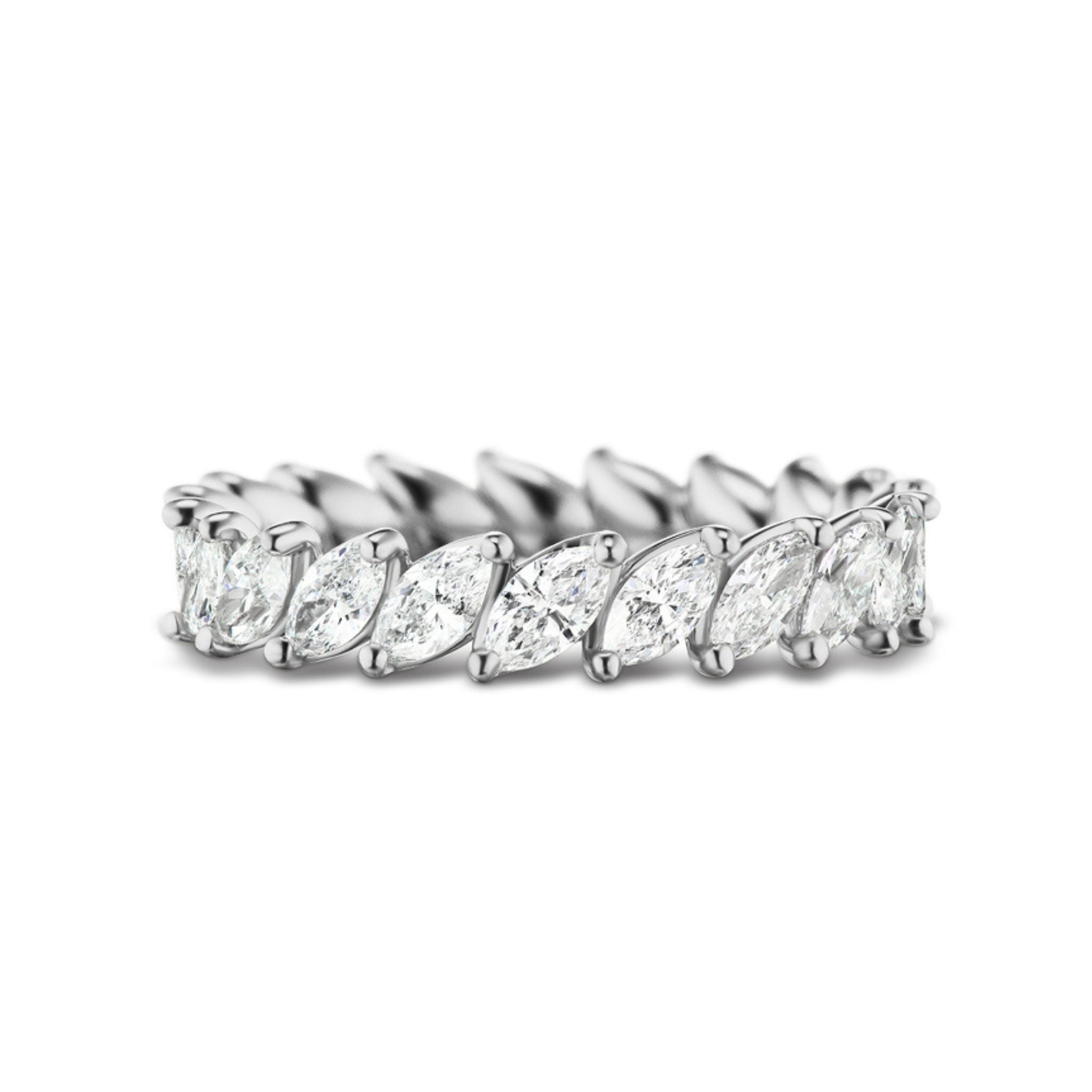 The Marching Marquise Eternity Band showcases marquise-cut diamonds set in a continuous silver band, perfect as a bridal or celebration ring, beautifully displayed on a white background.