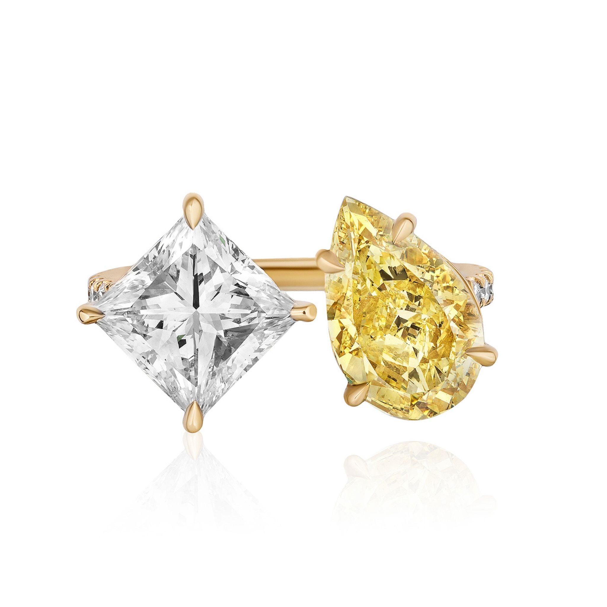 The Toi et Moi Pavé Ring features a fancy yellow pear diamond and a white princess-cut diamond set side by side in prongs.