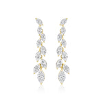 The Marquise Diamond Waterfall Drop Earrings showcase a vertical row of marquise cut diamonds in a leafy, vine-inspired gold design for a delicate, sparkling look.