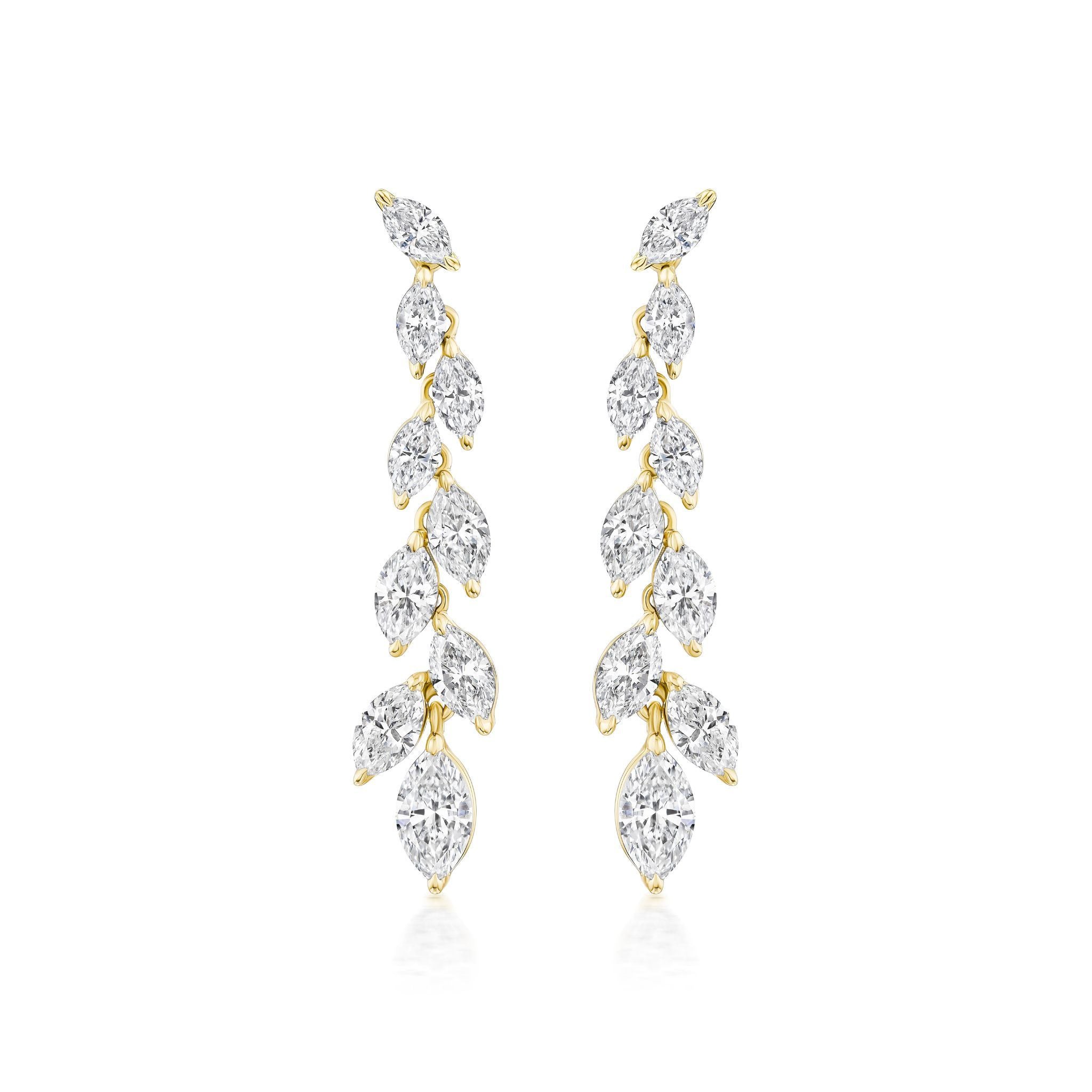 The Marquise Diamond Waterfall Drop Earrings showcase a vertical row of marquise cut diamonds in a leafy, vine-inspired gold design for a delicate, sparkling look.