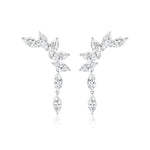 The Climbing Ivy Waterfall Earrings feature clusters of marquise diamonds arranged in a delicate leafy design, set in lustrous 18K white gold.