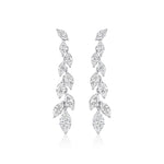 The Marquise Diamond Waterfall Drop Earrings feature a symmetrical cascading leaf design with sparkling marquise cut diamonds set in polished 18k white gold for a delicate, luxurious look.