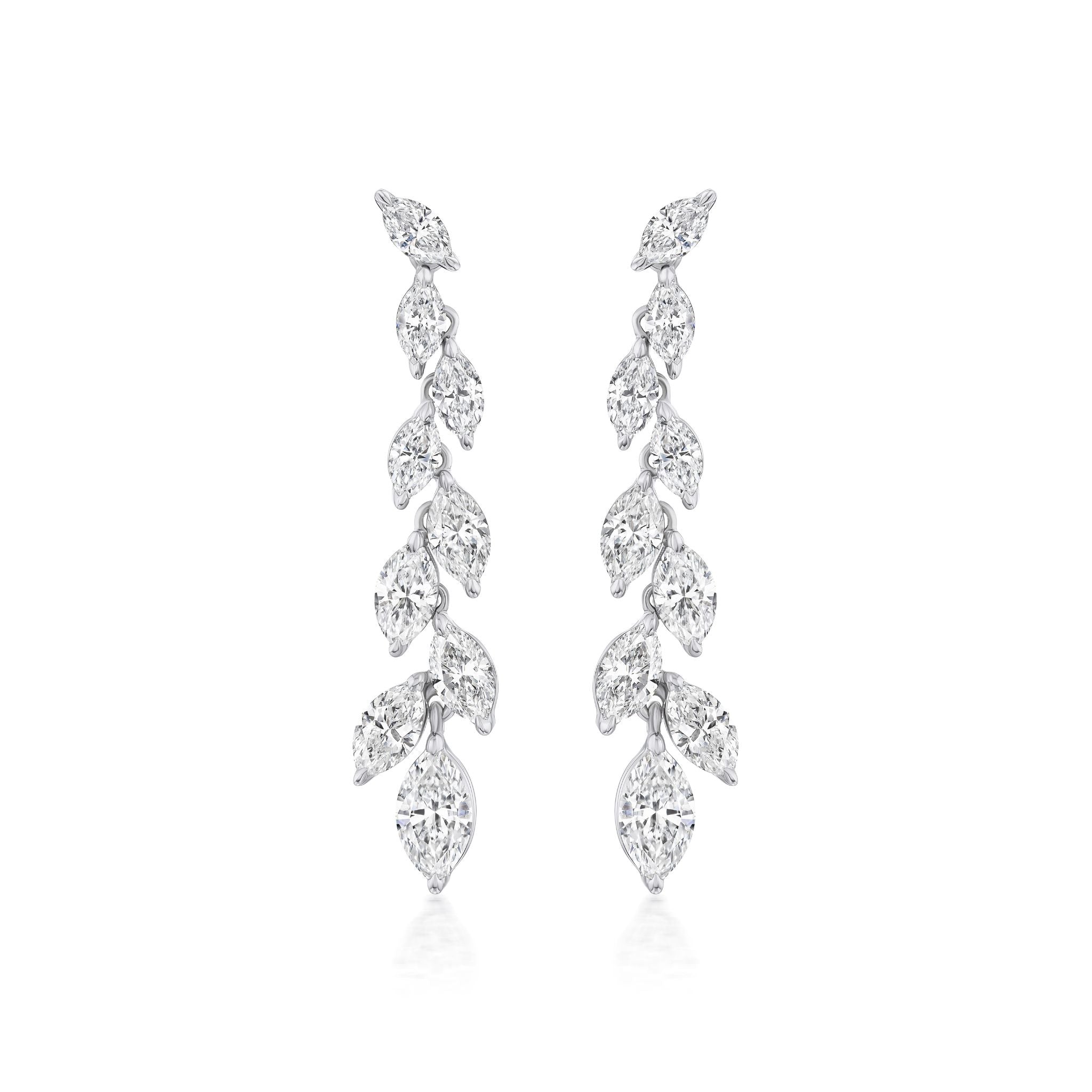 The Marquise Diamond Waterfall Drop Earrings feature a symmetrical cascading leaf design with sparkling marquise cut diamonds set in polished 18k white gold for a delicate, luxurious look.