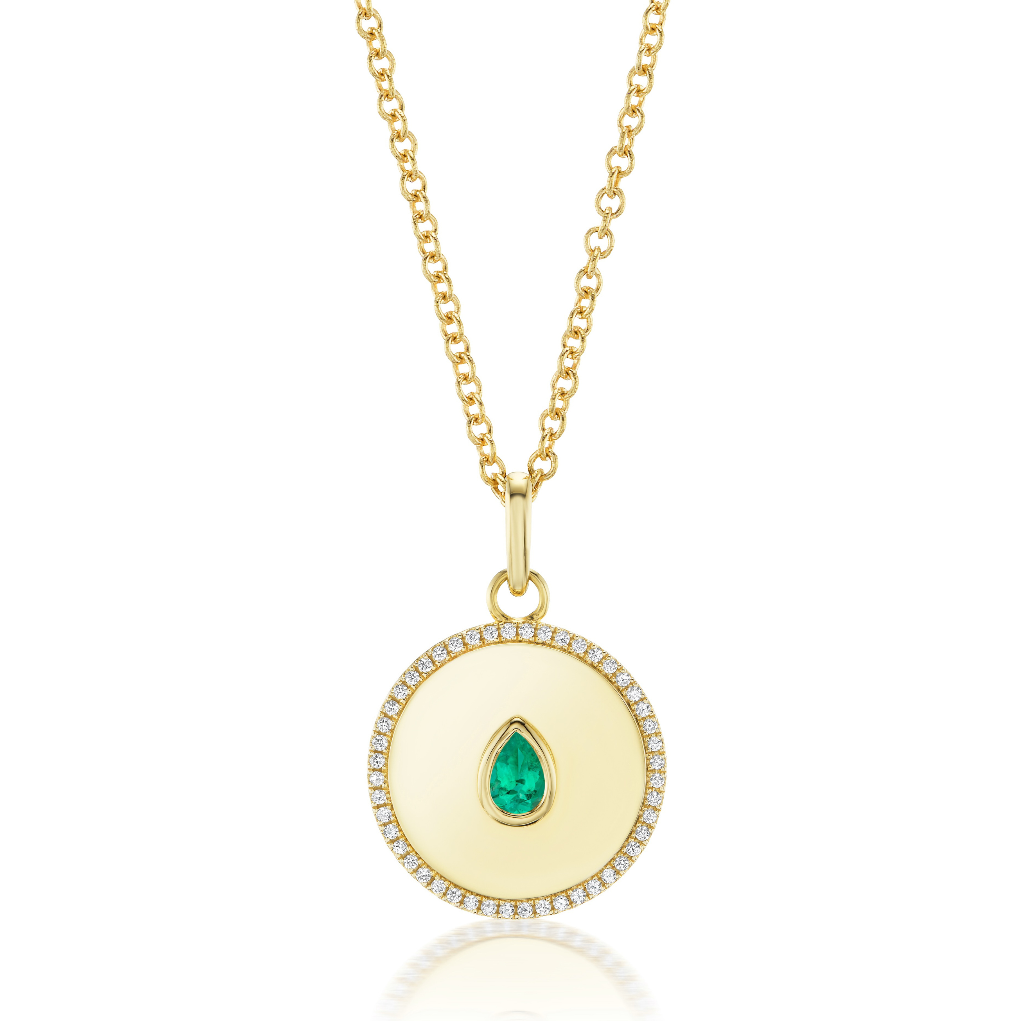 The Medallion Pendant Necklace features a bezel-set pear shape emerald in yellow gold, accented by diamond pavé on the round pendant and finished with a simple gold link chain for an elegant look.