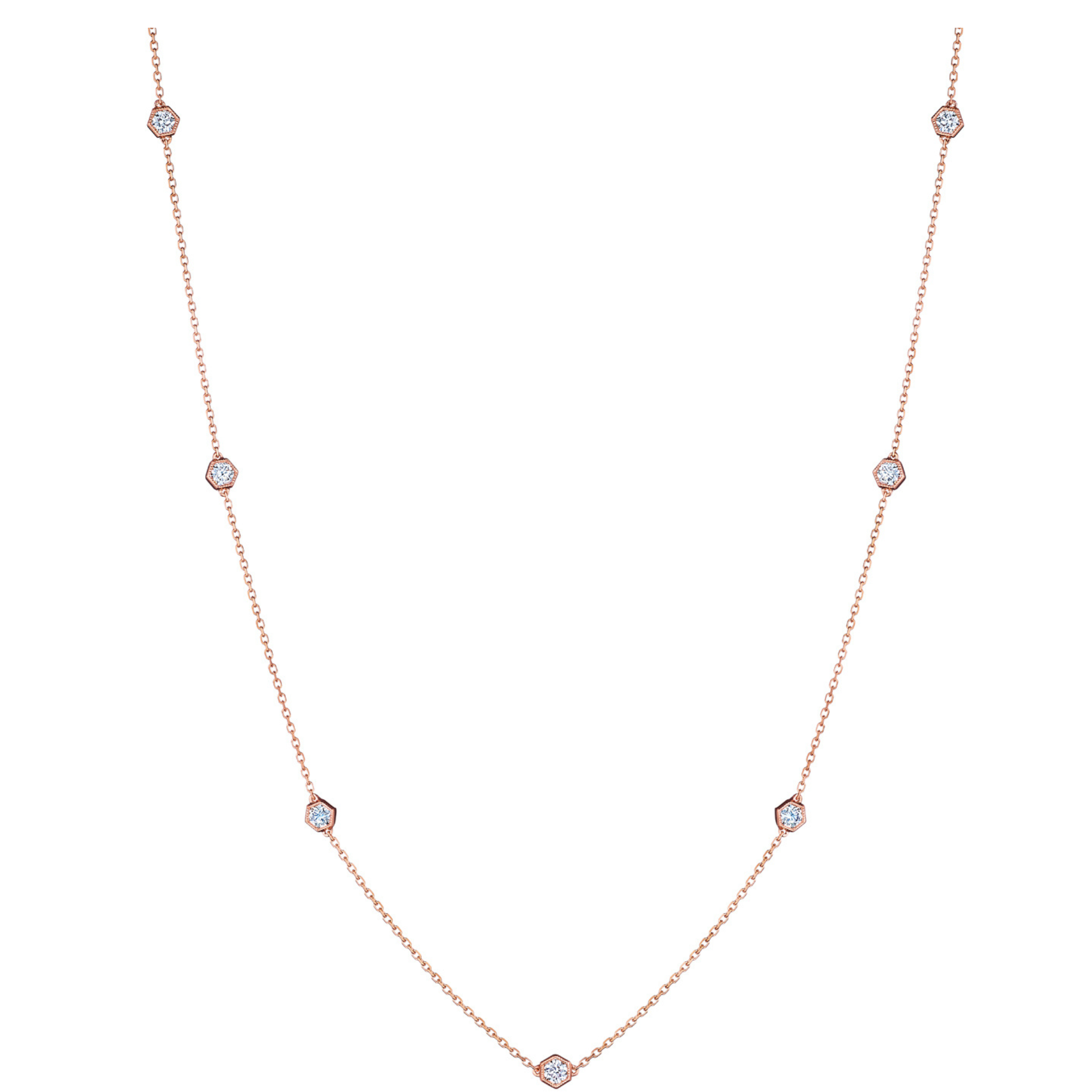 The Medium Serpentine Station Necklace features 18K rose gold with round diamonds set in hexagon bezels spaced along the chain, shown on a white background.