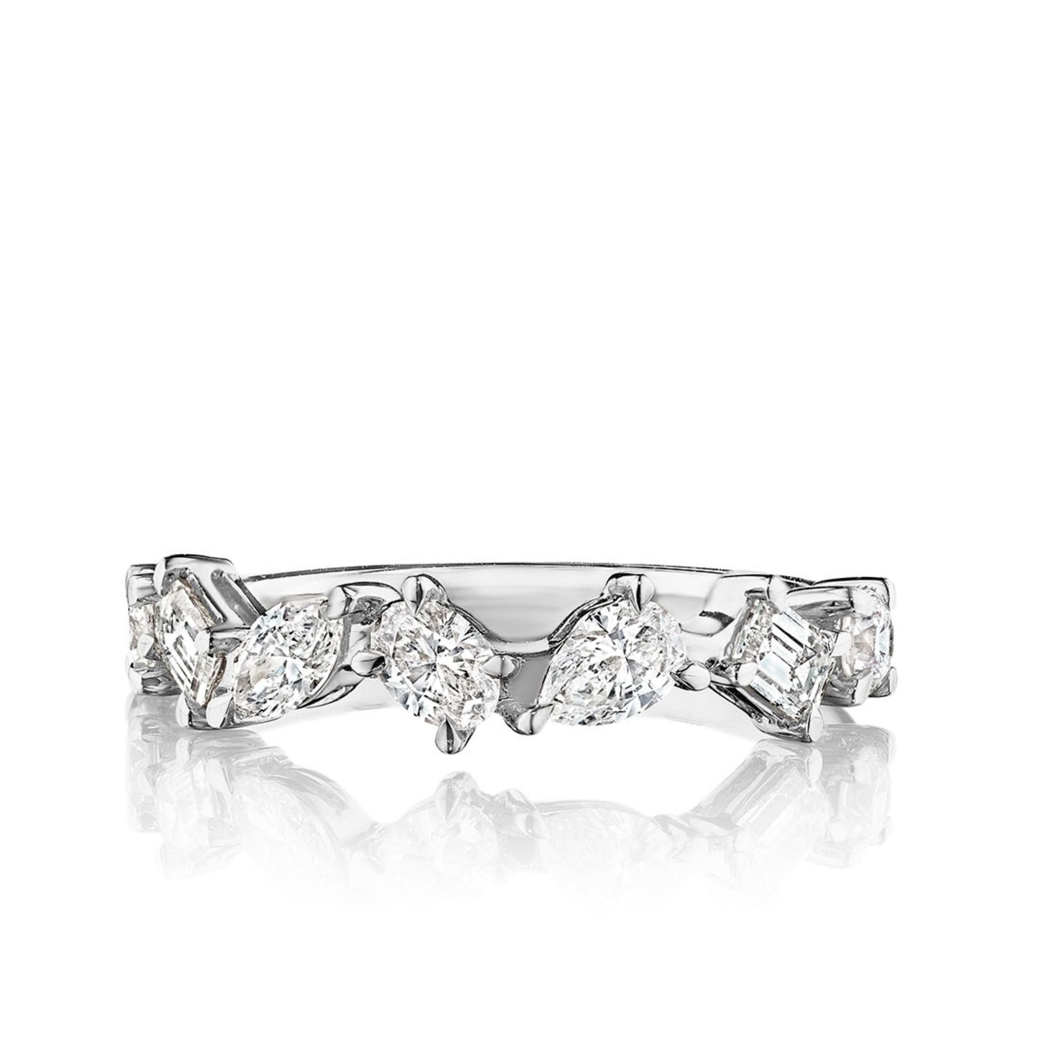 The Mixed Shape Diamond Half Eternity Band in white gold features alternating marquise, pear, and princess-cut diamonds in a continuous design—ideal as a bridal or celebration ring, shown on a reflective surface.