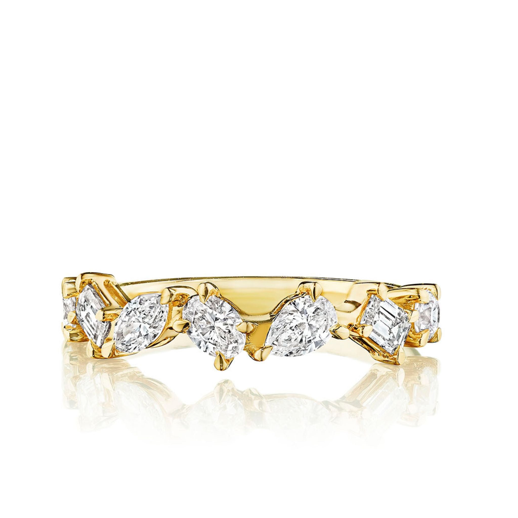 The Mixed Shape Diamond Half Eternity Band features alternating marquise, pear, oval, and emerald-cut diamonds set in gold, ideal as a celebration or bridal ring. Shown on a white background.