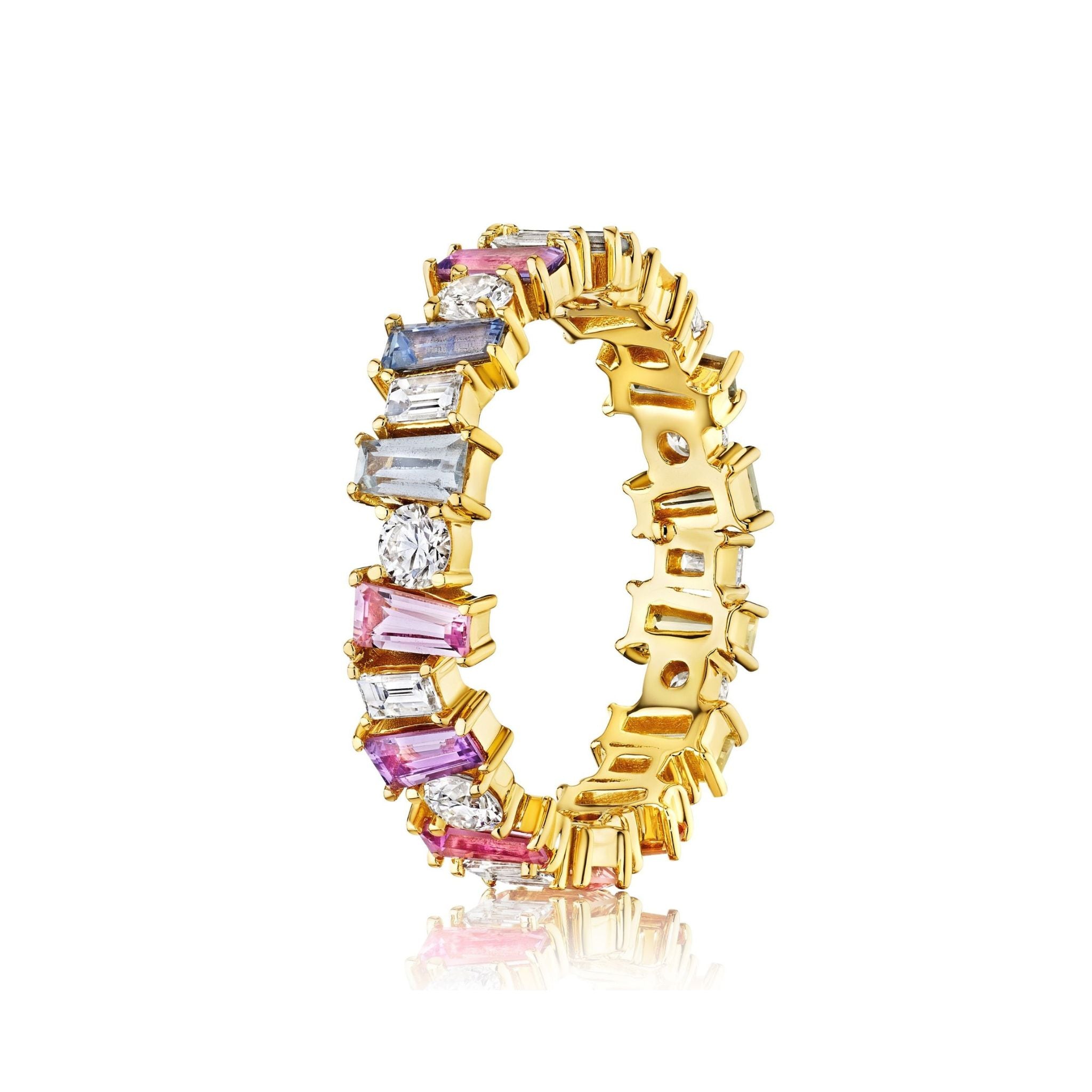The Multicolor Eternity Band in Yellow Gold features tapered baguette sapphires and round diamonds in pink, blue, clear, and purple, crafted in 18K yellow gold and shown on a white background.