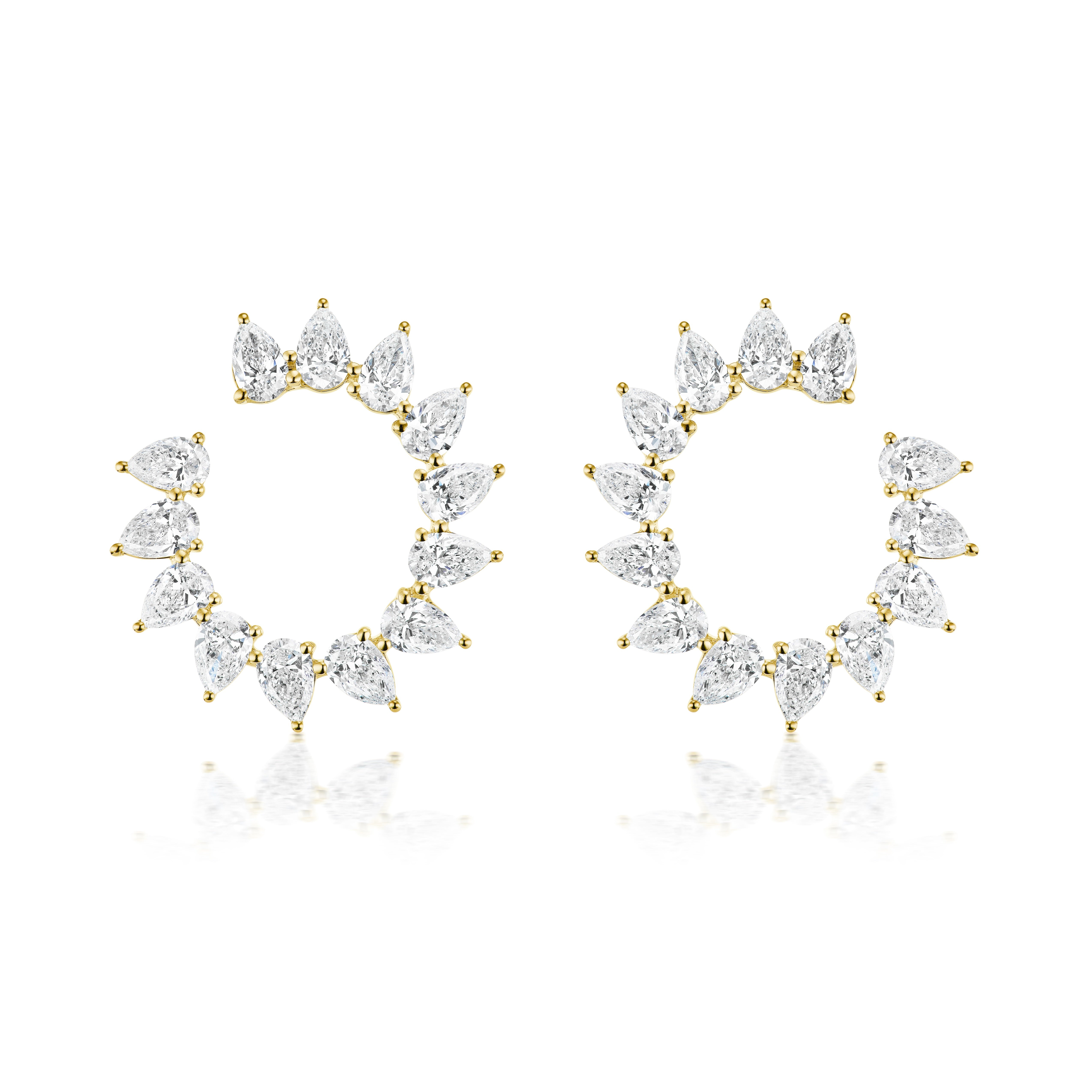 The Sunshine Front-to-Back Hoops Small are 18k gold earrings featuring multiple pear-shaped clear gemstones arranged evenly around each open hoop, creating a radiant sunshine-inspired design.