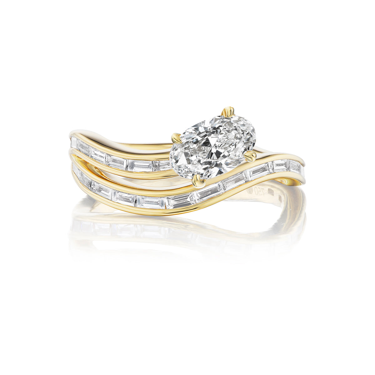 The Snake Wave Channel Set Baguette Diamond Ring features an 18K gold wavy band with baguette diamonds and a striking oval diamond centerpiece, shown against a white background.