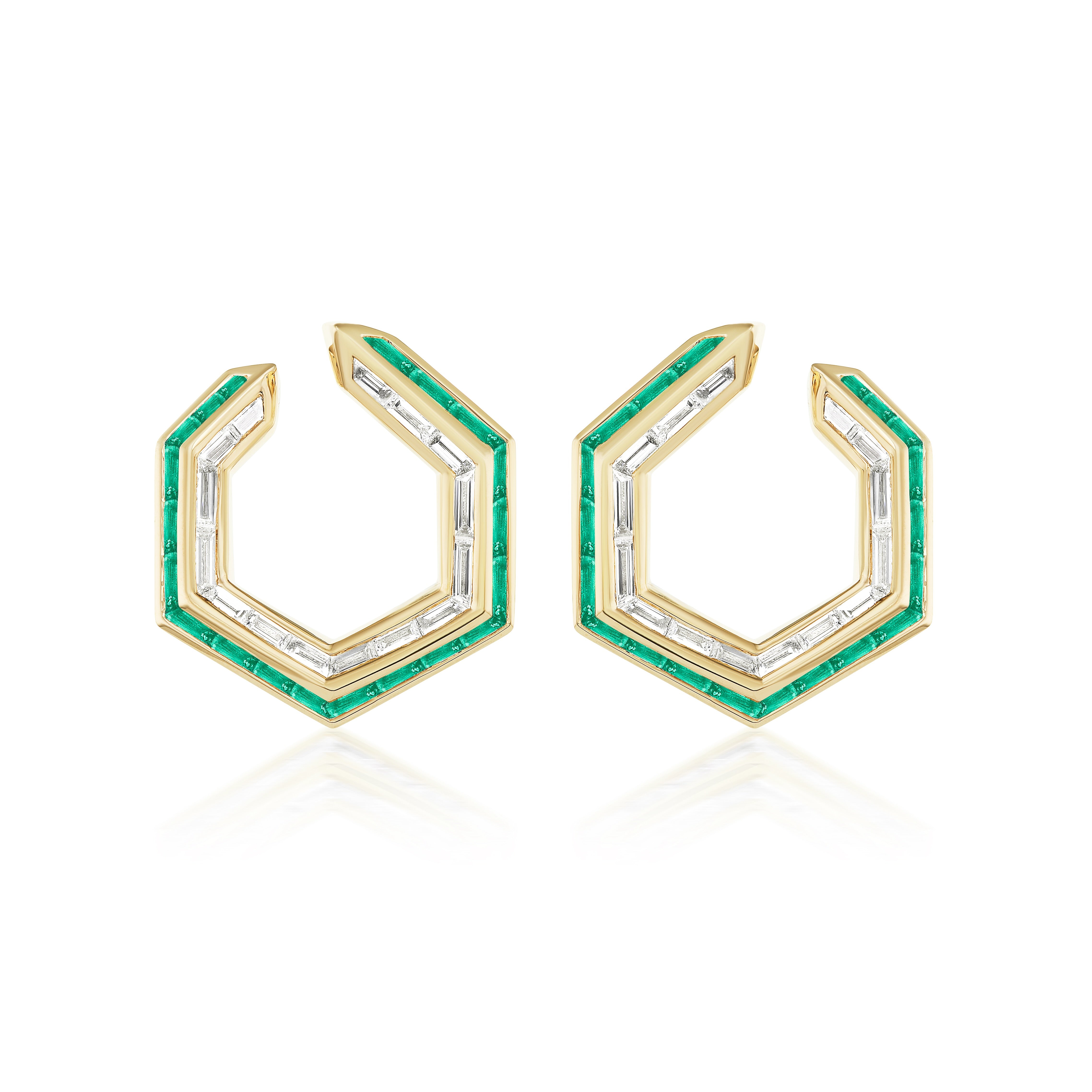The Chrysler Front-to-Back Hoops feature a geometric hexagonal design in 18K yellow gold, adorned with baguette diamonds and a border of small emerald baguettes along the outer edge.