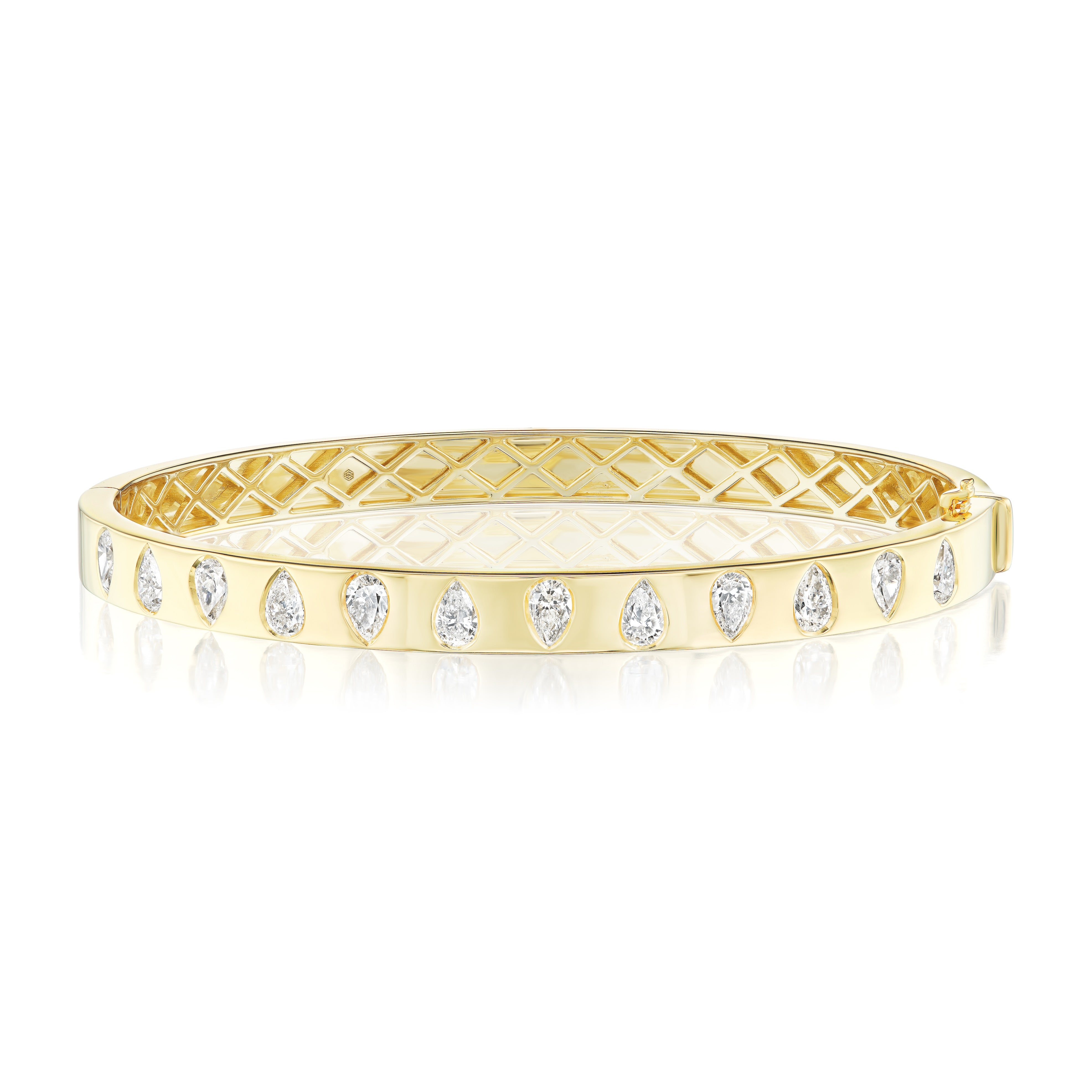 The Burnish Set Alternating Pear Shape Diamond Bangle in Yellow Gold features SI+ clarity pear-shaped diamonds set along the outer surface with an inner lattice pattern, crafted in 18K yellow gold and shown on a reflective white background.
