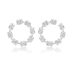 The Oval Diamond Front to Back Hoop Earrings in white gold feature eleven round diamonds set evenly along each 18k hoop, displayed on a white background with a subtle reflection.