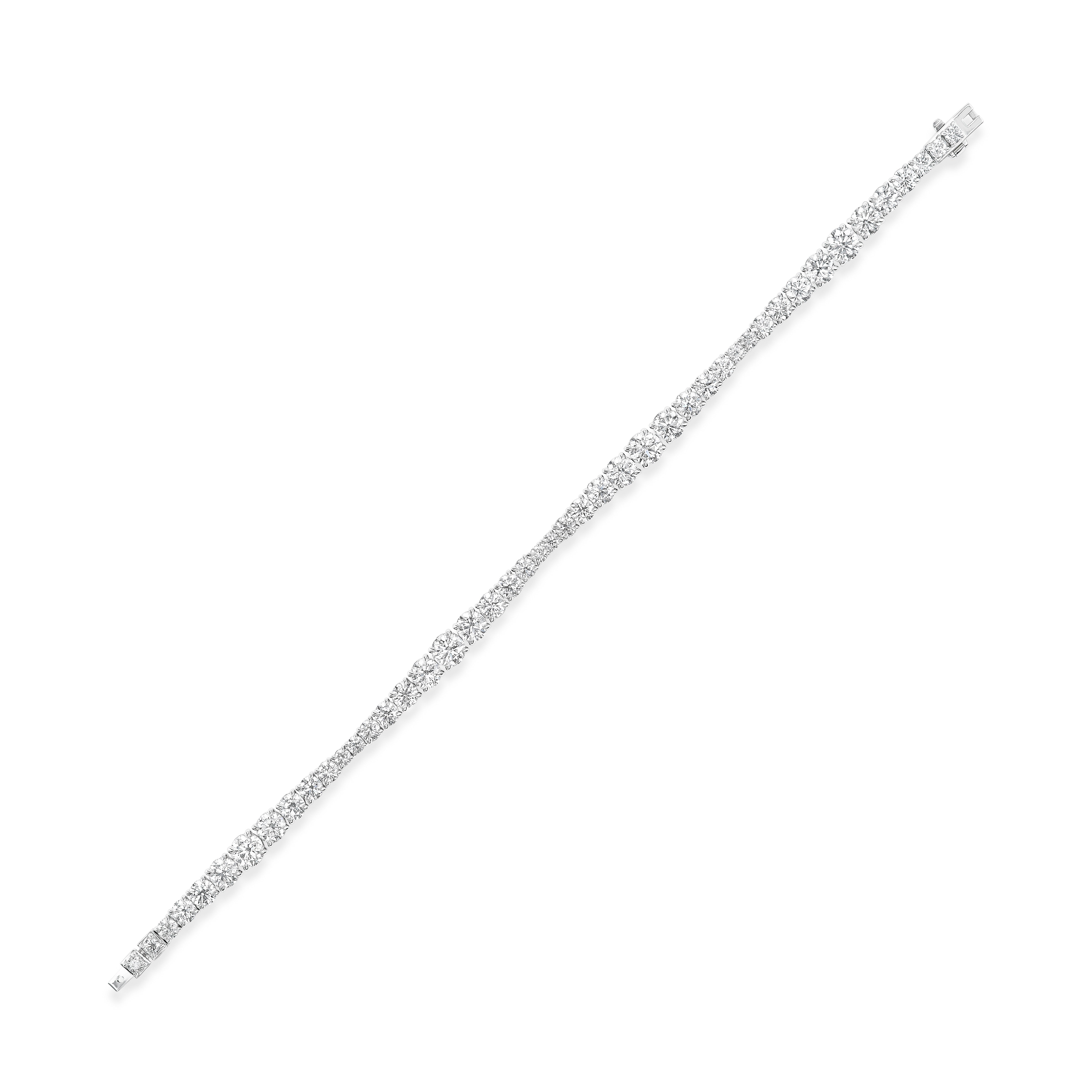 The Wave Graduated Round Diamond Tennis Bracelet in white gold showcases a delicate row of sparkling round diamonds, elegantly set on a pristine white background.