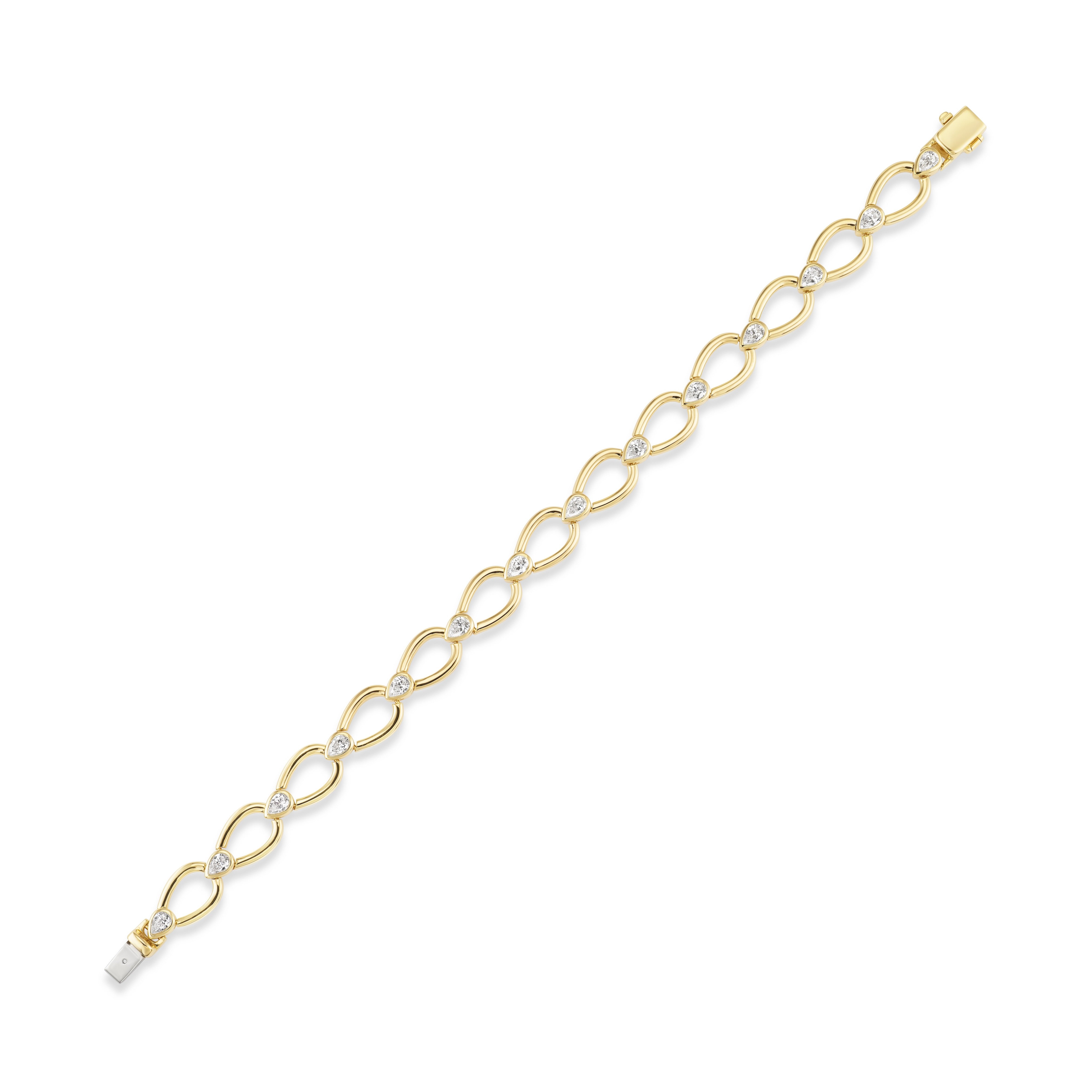 The Pear Shape Link Bracelet features bezel set pear-shaped diamonds linked in 18k yellow gold, shown on a white background.