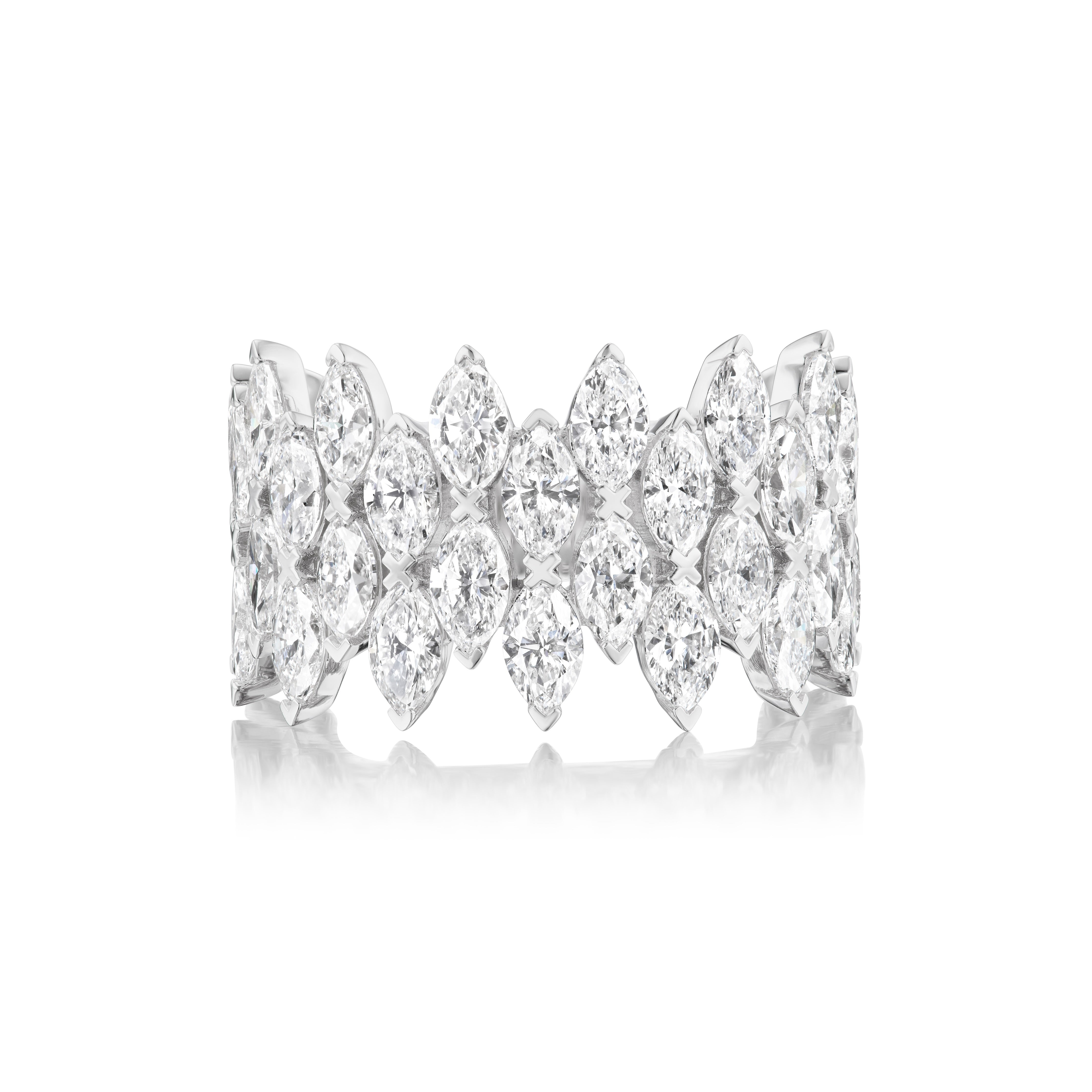 The Multi Tier Marquise Diamond Eternity Band features round and marquise-cut diamonds in a floral pattern on a white metal band, elegantly displayed against a white background.