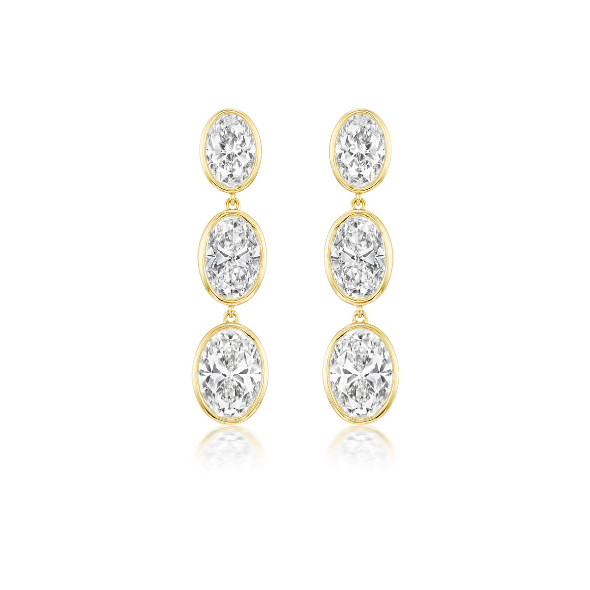 Graduating Bezel Set Oval Diamond Drop Earrings in Yellow Gold