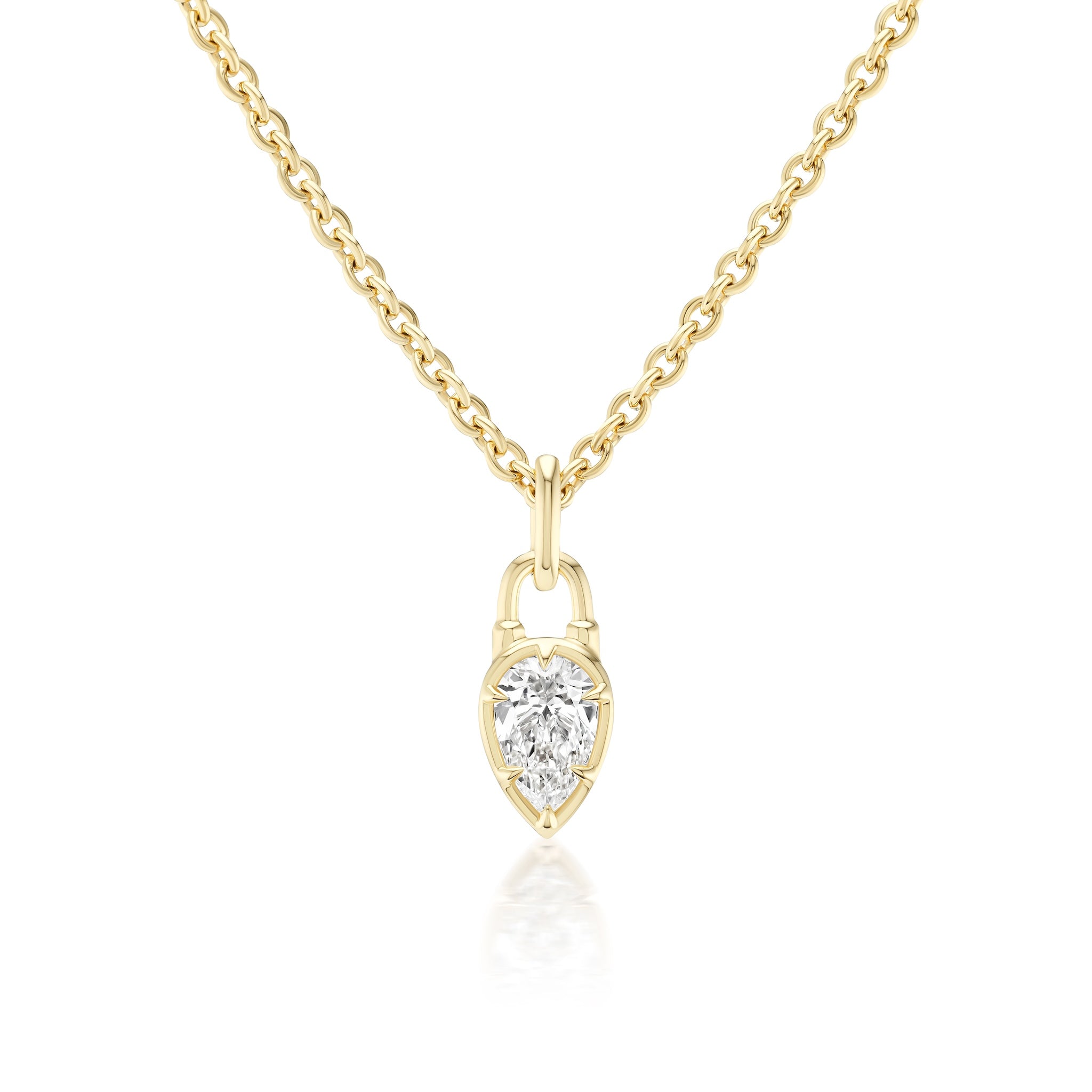 The Locket Motif Diamond Pendant Necklace features a pear-shaped diamond set in a gold bezel, inspired by a locket motif. The elegant pendant hangs from a simple gold chain.