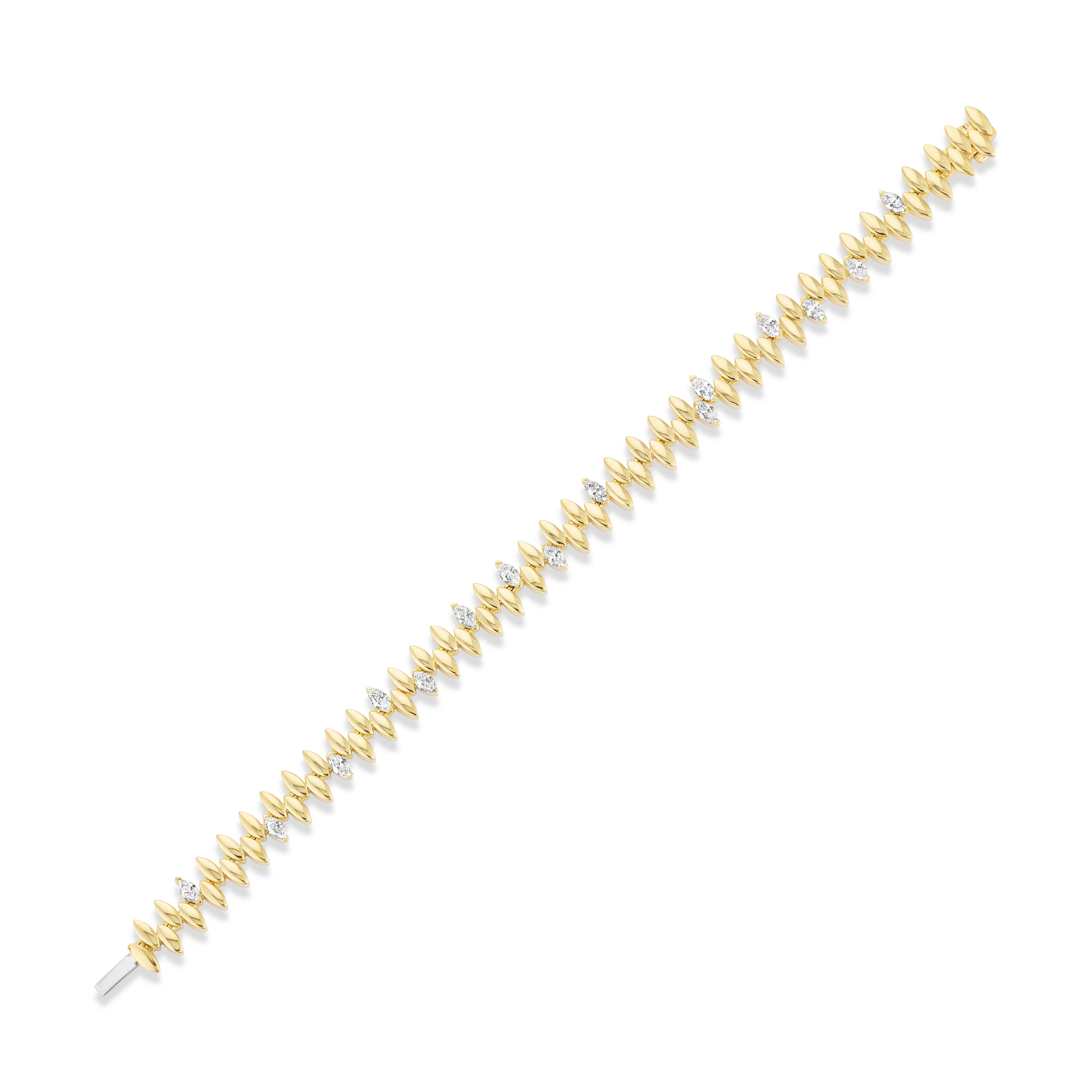 The Alternating Diamond Marquise Tennis Bracelet in Yellow Gold features leaf-shaped links and round white gemstones, inspired by the marquise diamond design, displayed diagonally on a white background.