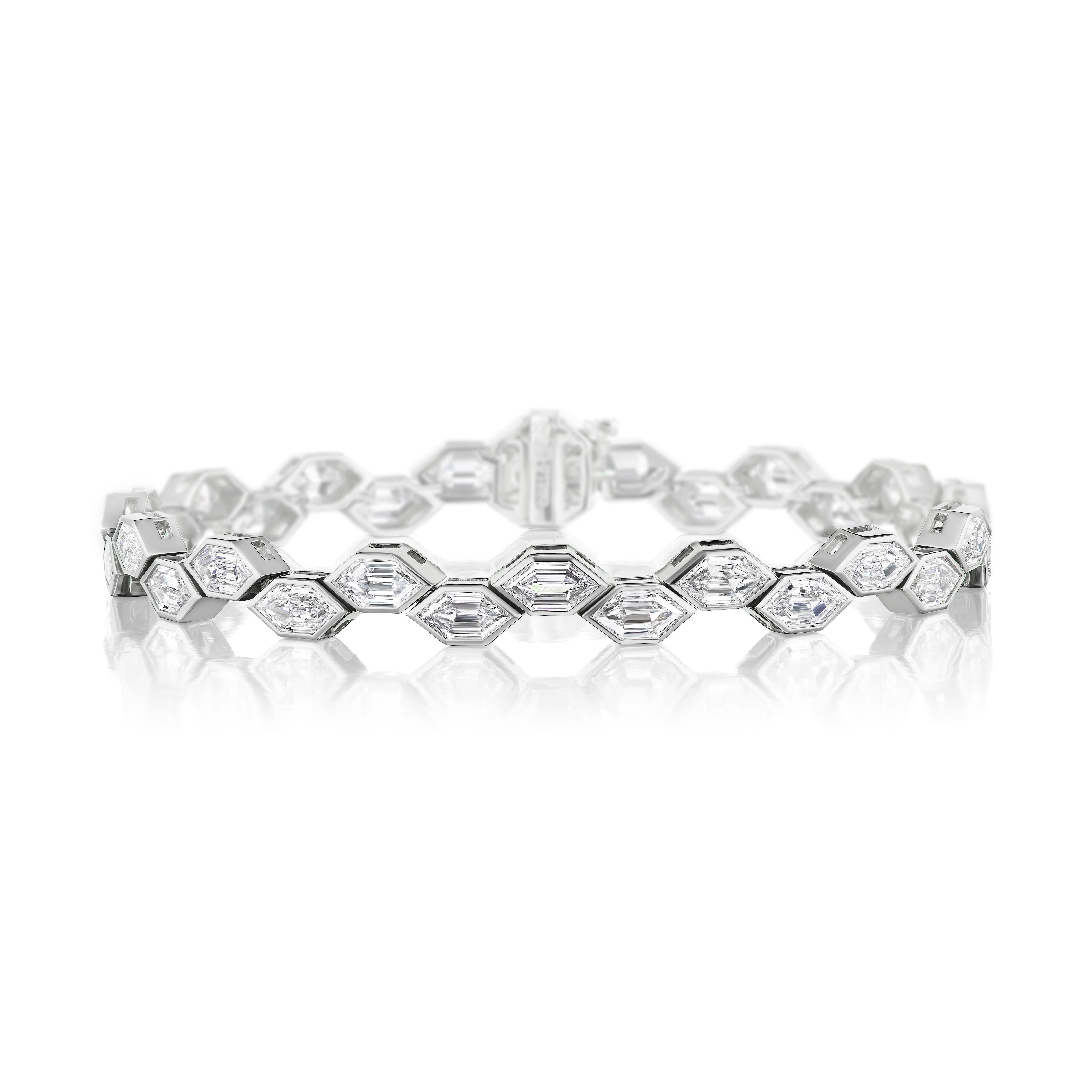 The Bezel Set East-West Elongated Hexagon Diamond Tennis Bracelet in Platinum features sleek hexagon diamonds in bezel settings, creating a reflective, elegant design with a secure clasp for lasting sophistication.